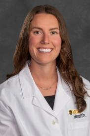 Carly Watson, M.D. in white coat
