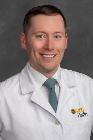 James Carr, D.O. in white coat